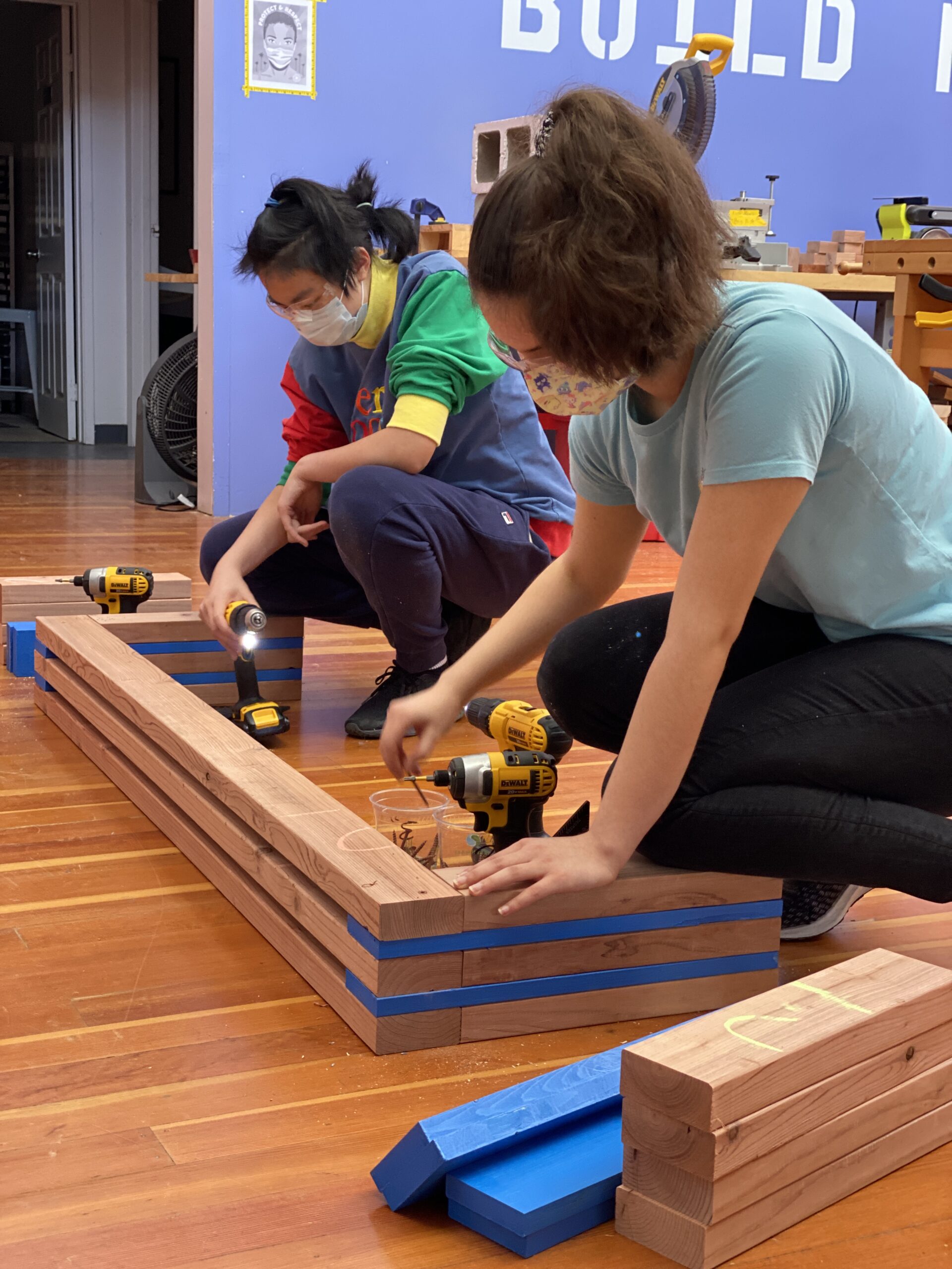 Girls build benches for Operation Homebase at Girls Garage
