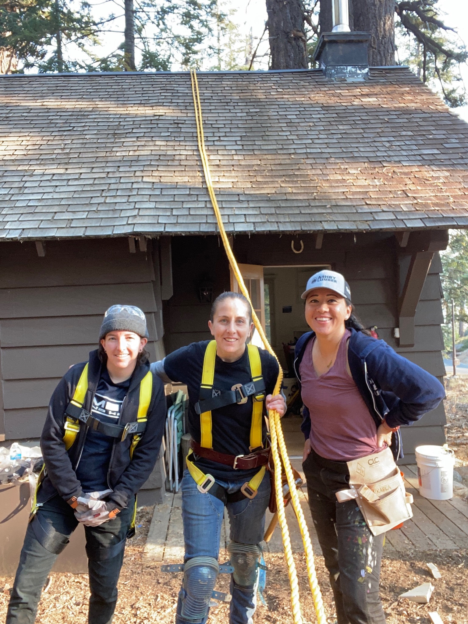 Girls Garage instructors fix a ranger cabin