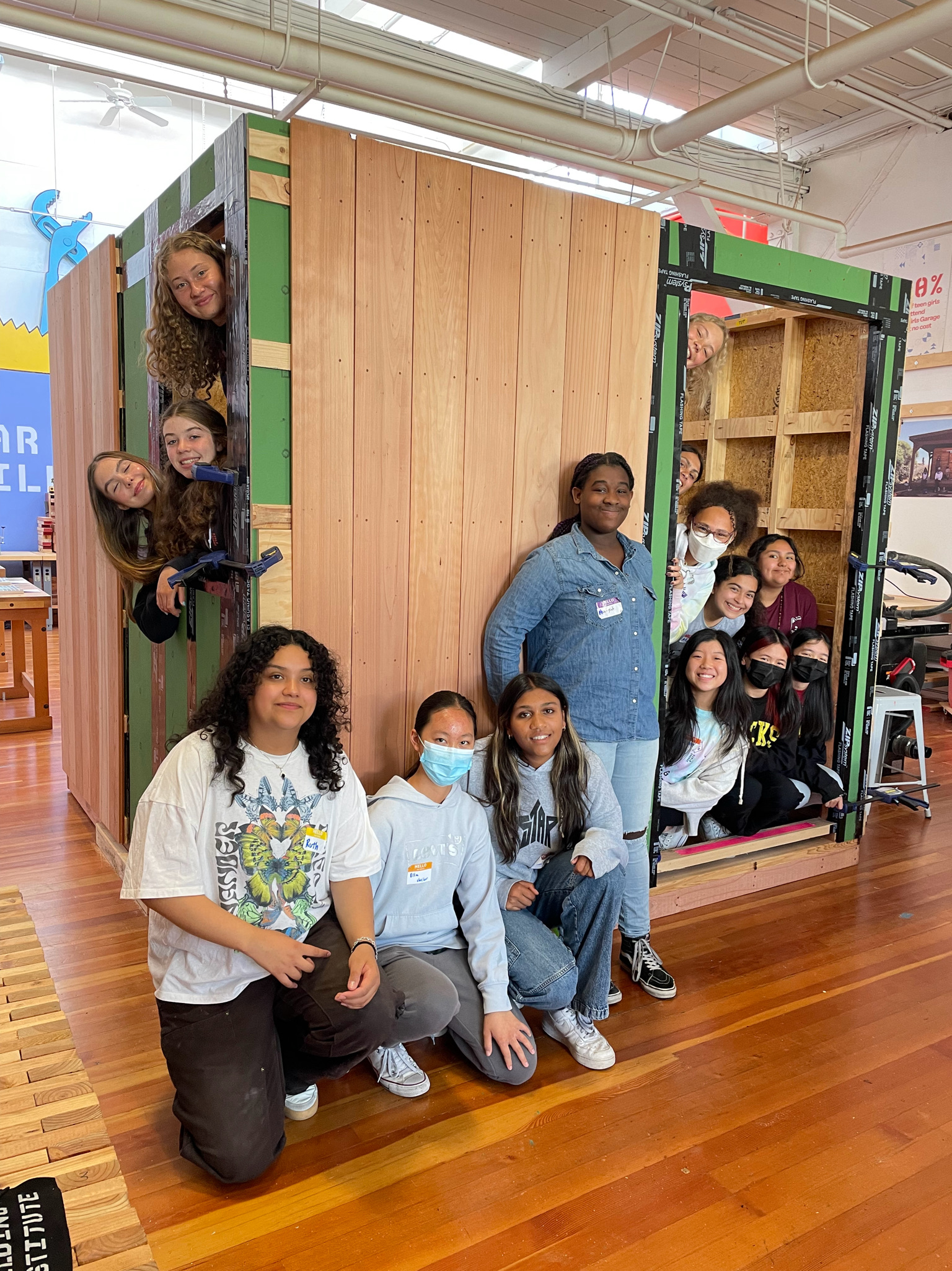 YWDBI students inside sauna frame