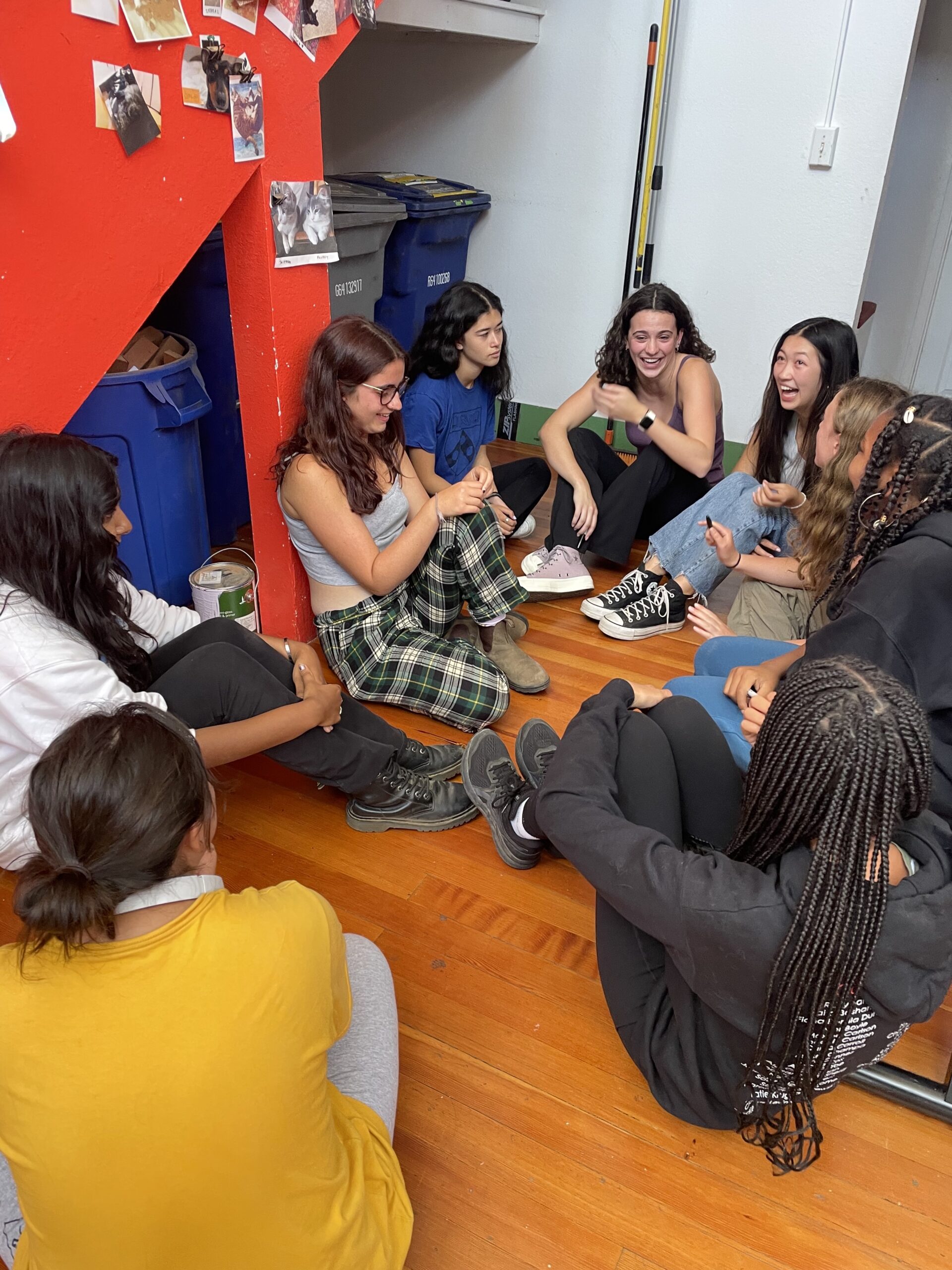 Girls Garage students huddle to say a last goodbye