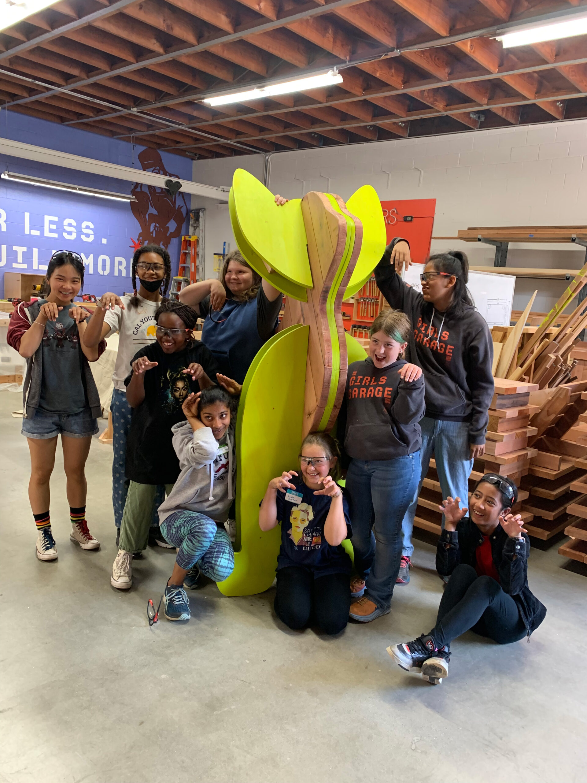 Students in front of cat sculpture